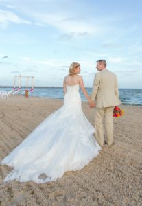 bride and groom walking in the sand at Rockport Beach