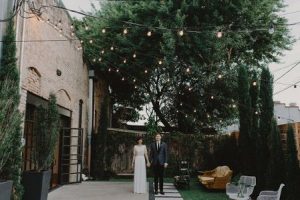 bride and groom in the courtyard at One Eleven East