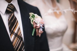 close up of groom's wedding boutonniere