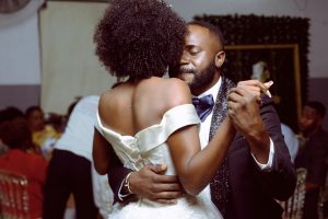 bride and groom dancing close