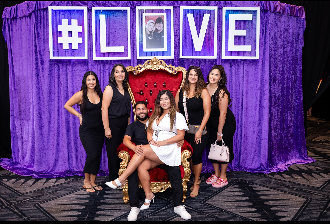 VIP guests posing in the Engagement Lounge